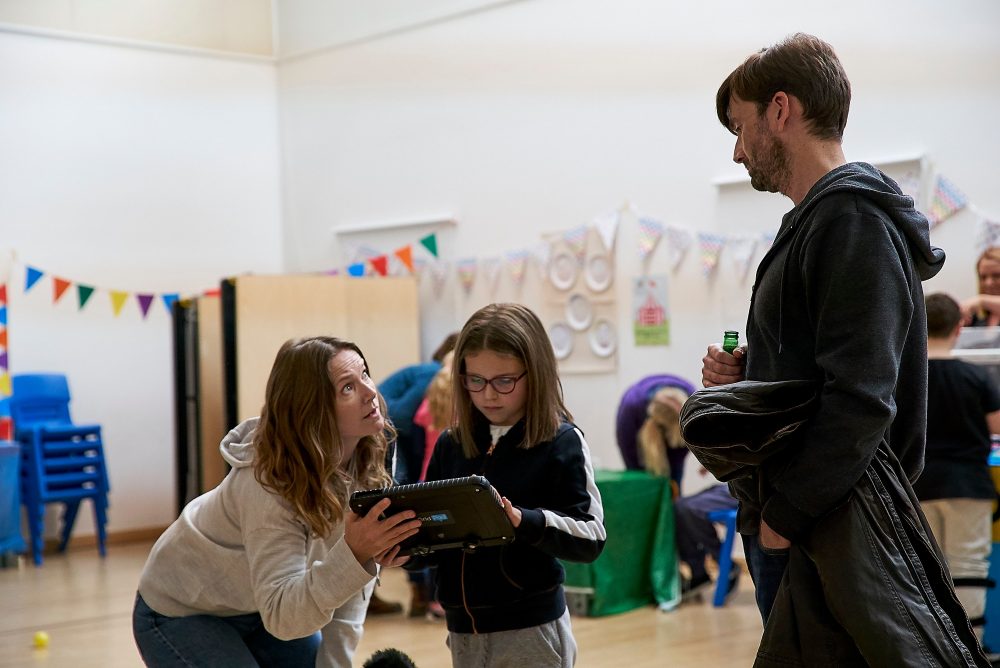 Emily (Jessica Hynes), left, is shown with Rosie (Miley Locke) and Simon (David Tennant) in a scene from ‘There She Goes.’