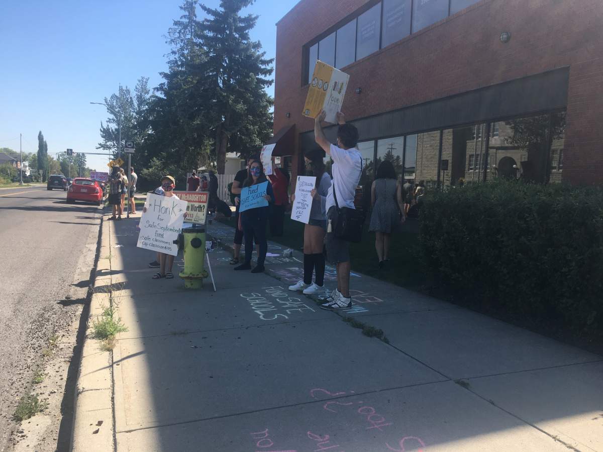 Protesters gather in the Calgary Varsity riding Friday, Aug. 21, 2020, calling on the UCP government for additional funding for schools ahead of the 2020 return to class.