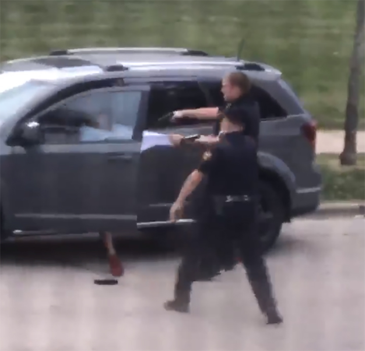 A police officer pulls on Jacob Blake’s shirt, moments before shooting him on Aug. 23, 2020, in Kenosha, Wisc.
