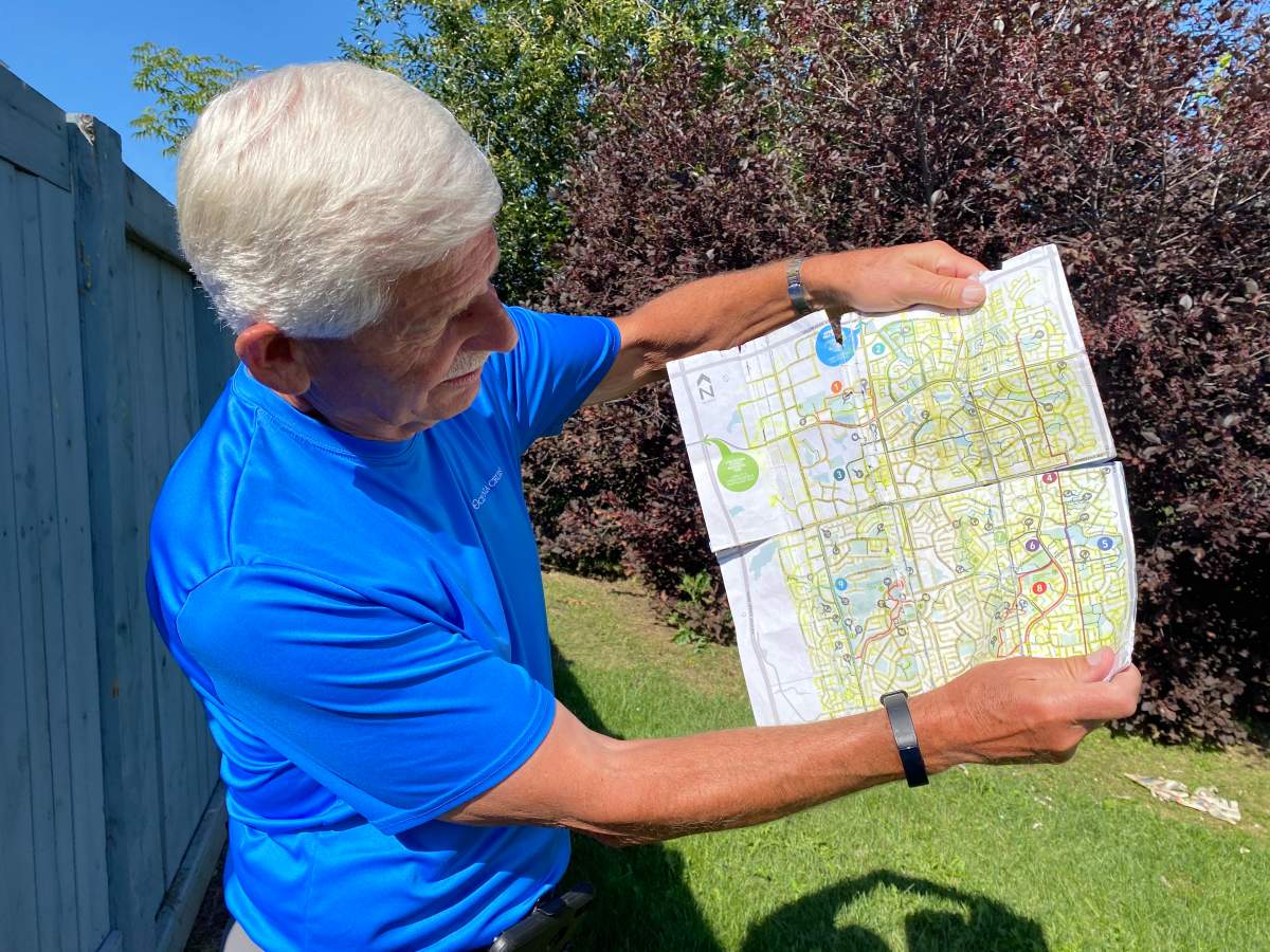 Terry Fikowski holds his map