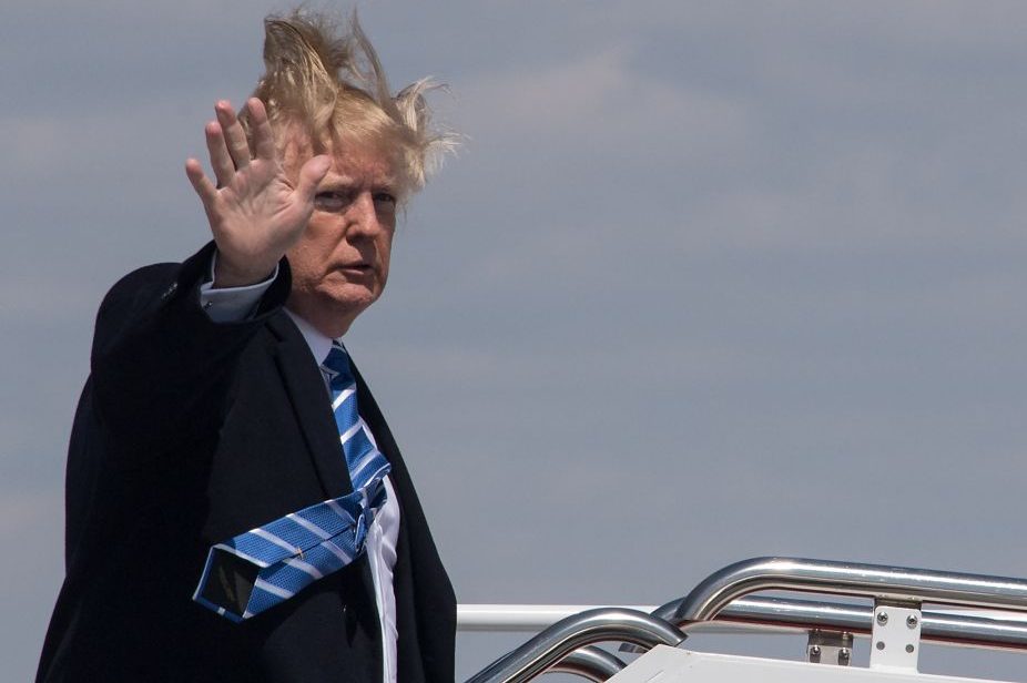U.S. President Donald Trump boards Air Force One on a windy day at Andrews Air Force base on Apr. 5, 2018 near Washington, D.C.