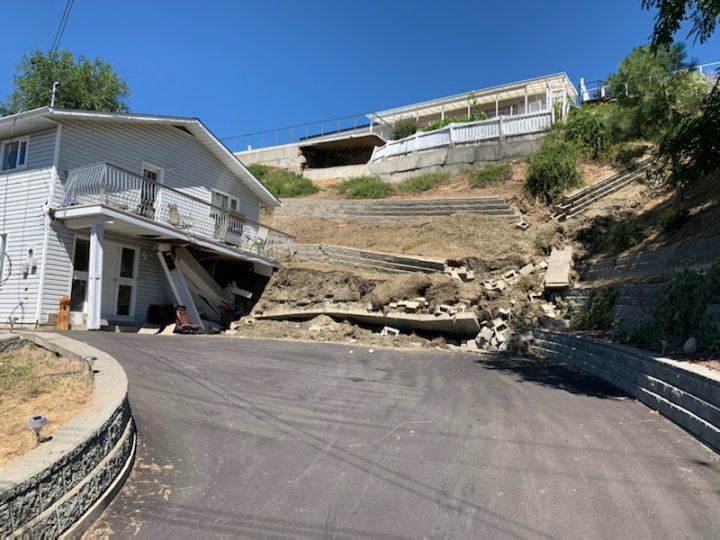 A retaining wall collapsed following a landslide along Creekside Road in Penticton, B.C., on Aug. 6, 2020.