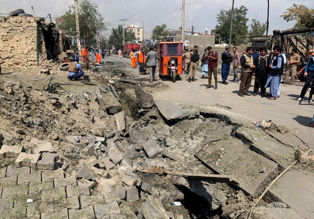 Afghan security personnel and Municipality workers work at the site of an explosion in Kabul, Afghanistan, Wednesday, Sept. 9, 2020.