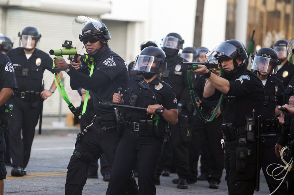 FILE - In this May 30, 2020, file photo, police aim weapons on demonstrators protesting the death of George Floyd, in Los Angeles. Police unions and other law enforcement organizations went into overdrive in the final days of the Legislature's annual session, thwarting a bill that would have added California to the majority of states that can end the careers of officers with troubled histories. 