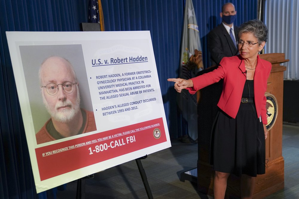 Audrey Strauss, Acting United States Attorney for the Southern District of New York, points to an image depicting Robert Hadden during a news conference to announce his arrest and indictment, Wednesday, Sept. 9, 2020, in New York. Hadden, a former New York gynecologist, is accused of sexually abusing more than two dozen patients, including the wife of former presidential candidate Andrew Yang. He was charged with six counts of inducing others to travel to engage in illegal sex acts. 