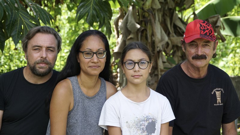 A group who have been stranded in Tahiti, pictured from left, Benjamin Baude, Kissy Ika Chavez Baude, Gaïa Baude Ika and Thierry Gourtay in Afareaitu on Moorea Island, Tahiti, Saturday, Sept. 19, 2020. A group of 25 residents from remote Easter Island has been stranded far from home for six months now. Many arrived in March planning to stay for just a few weeks. But they got stuck when the virus swept across the globe and their flights back home on LATAM airlines were canceled. LATAM says it doesn't know when it will restart the route.