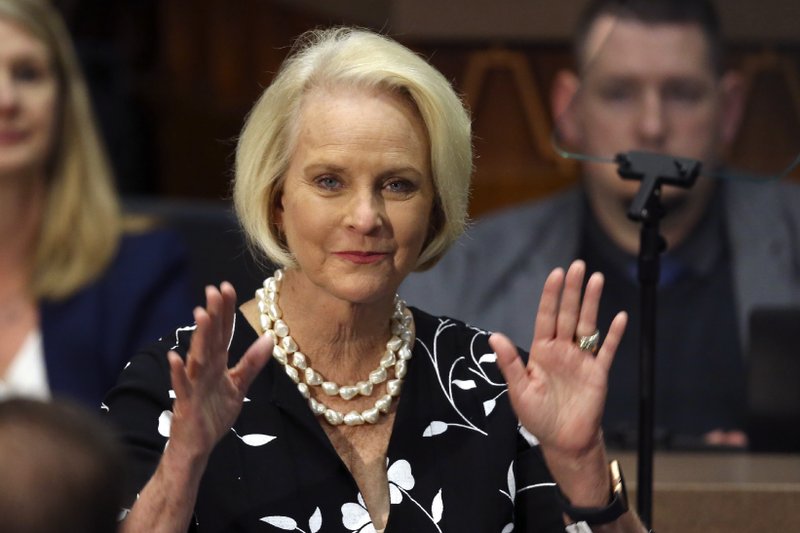 FILE - In this Jan. 13, 2020, file photo Cindy McCain, wife of former Arizona Sen. John McCain, waves to the crowd after being acknowledged by Arizona Republican Gov. Doug Ducey during his State of the State address on the opening day of the legislative session at the Capitol in Phoenix. Democratic presidential candidate former Vice President Joe Biden said Sept. 22 that Cindy McCain plans to endorse him for president. 