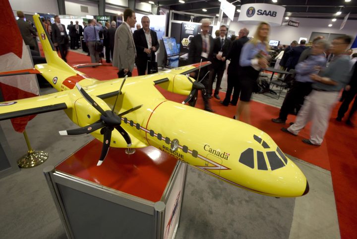FILE: Delegates pass a model of the Airbus C295 fixed wing search and rescue aircraft at the Canadian Association of Defence and Security Industries' CANSEC trade show in Ottawa on Wednesday, May 27, 2015. 