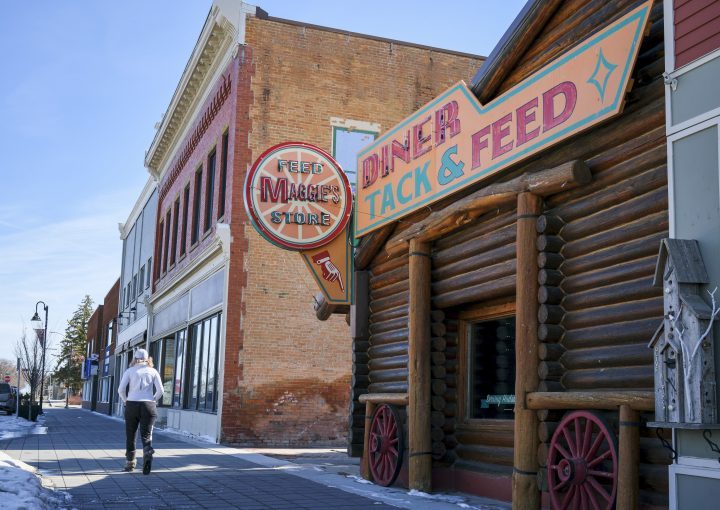FILE: A pedestrian passes by a set featured in the TV series "Heartland" in High River, Alta., Friday, March 27, 2020, amid a worldwide COVID-19 flu pandemic. 