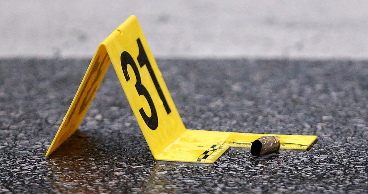 A shell casing is seen beside evidence marker #31 as Chicago police investigate the scene of a mass shooting near 79th Street at Morgan Street in Chicago, IL, USA on July 21, 2020. 
