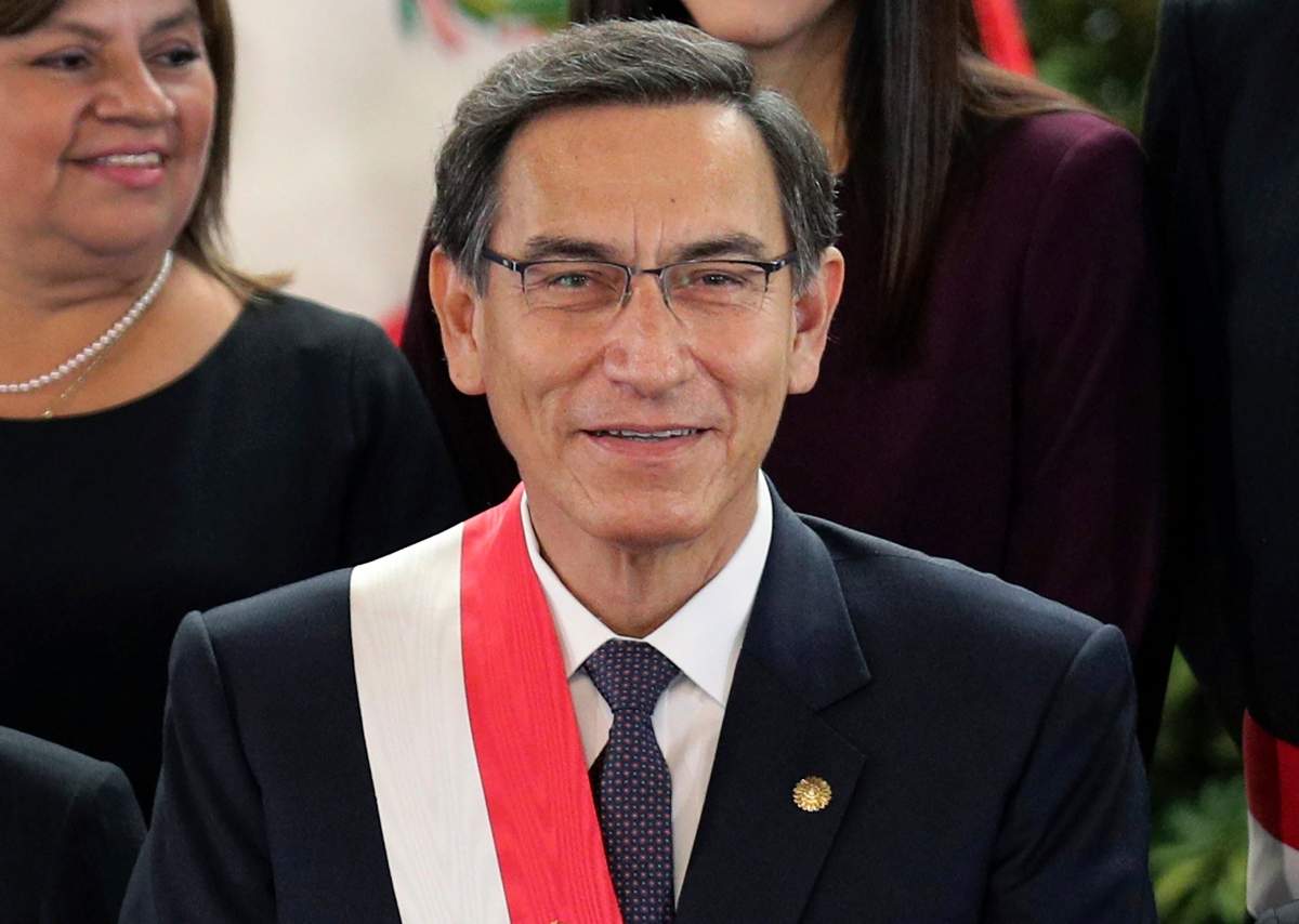 FILE - In this Oct. 3, 2019 file photo, Peru's President Martin Vizcarra smiles after the swearing-in ceremony of his new cabinet at the government palace in Lima, Peru. On July 28, 2020, the anniversary of independence, Vizcarra tried in a televised speech to galvanize a country battered, like so many others around the world, by economic calamity and mass death from the new coronavirus. 