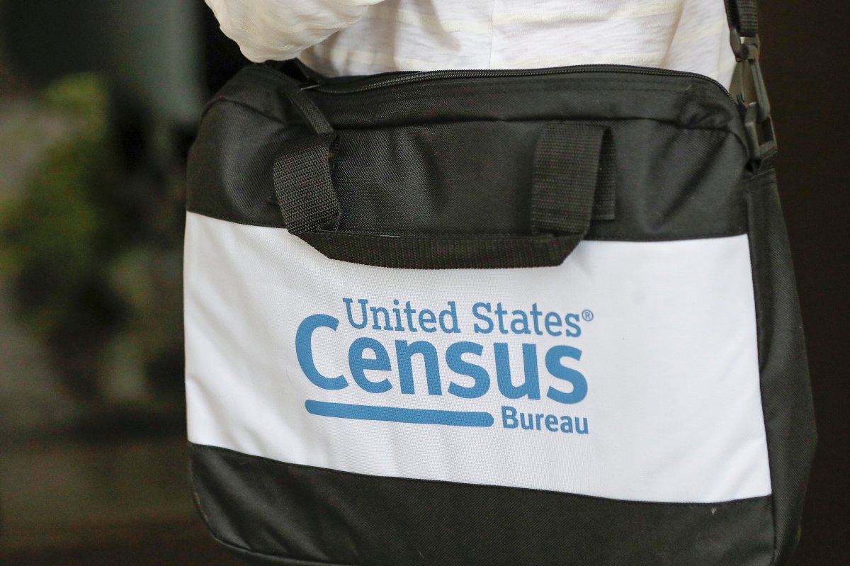 A briefcase of a census taker is seen as she knocks on the door of a residence Tuesday, Aug. 11, 2020, in Winter Park, Fla.