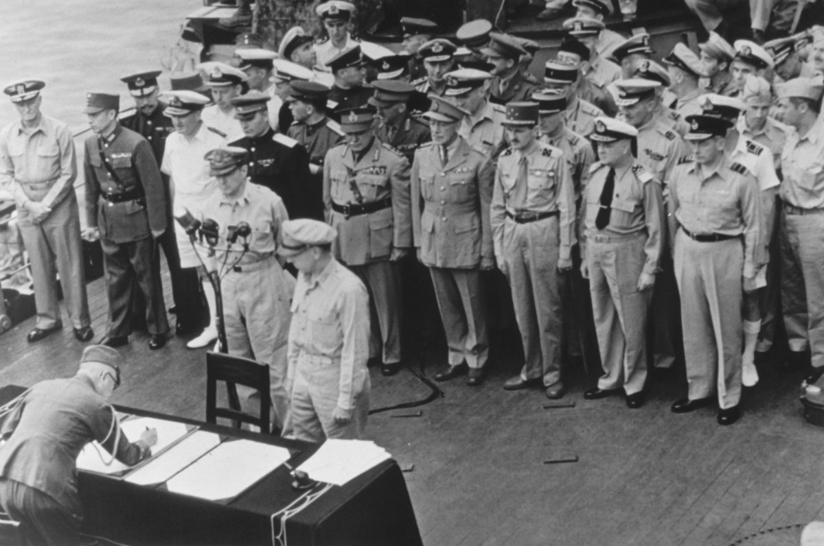 FILE - General of the Army Douglas MacArthur, Supreme Allied Commander, and General Wainwright, who surrendered to the Japanese after Bataan and Corregidor, witness the formal Japanese surrender signatures aboard the USS Missouri in Tokyo Bay on Sept. 2, 1945. Several dozen aging U.S. veterans, including some who were in Tokyo Bay as swarms of warplanes buzzed overhead and nations converged to end World War II, will gather on the battleship in Pearl Harbor in September to mark the 75th anniversary of Japan's surrender.
