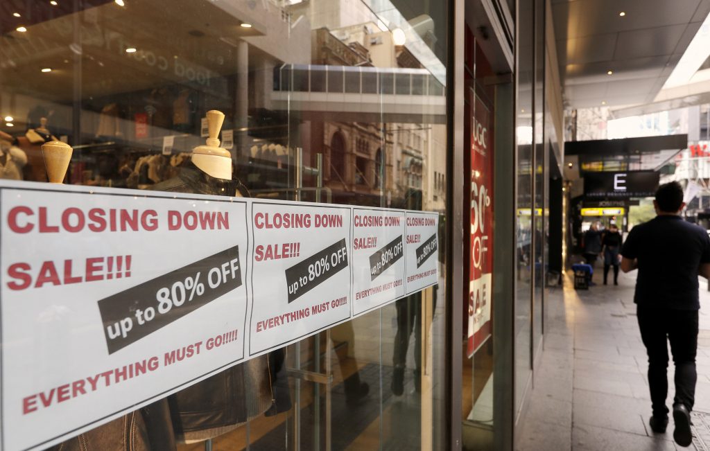 Signs in store window advertise that they are closing in Sydney, Wednesday, Sept. 2, 2020. Australia's economy has suffered its sharpest quarterly drop since the Great Depression because of the pandemic, with data released on Wednesday confirming the country is experiencing its first recession in 28 years. 