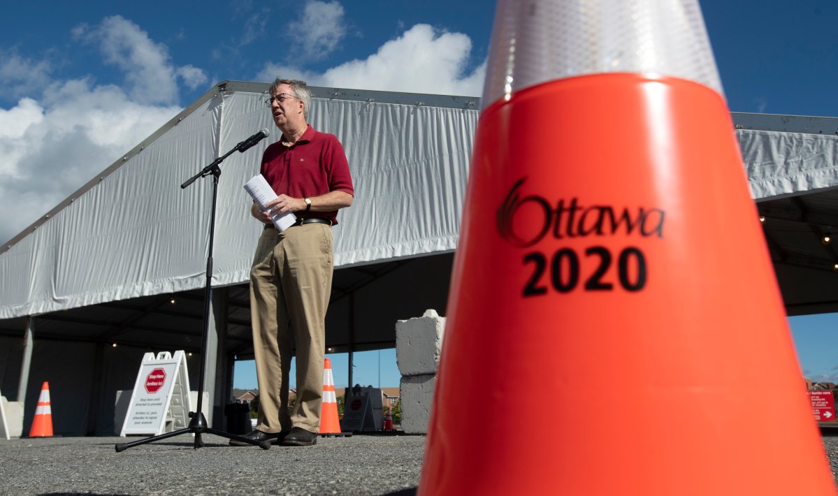 Ottawa Mayor Jim Watson speaks at the opening of a COVID-19 drive through testing centre in Ottawa, Friday, September 4, 2020.  Watson said on Twitter the city's latest spike of 61 COVID-19 cases is "concerning.".