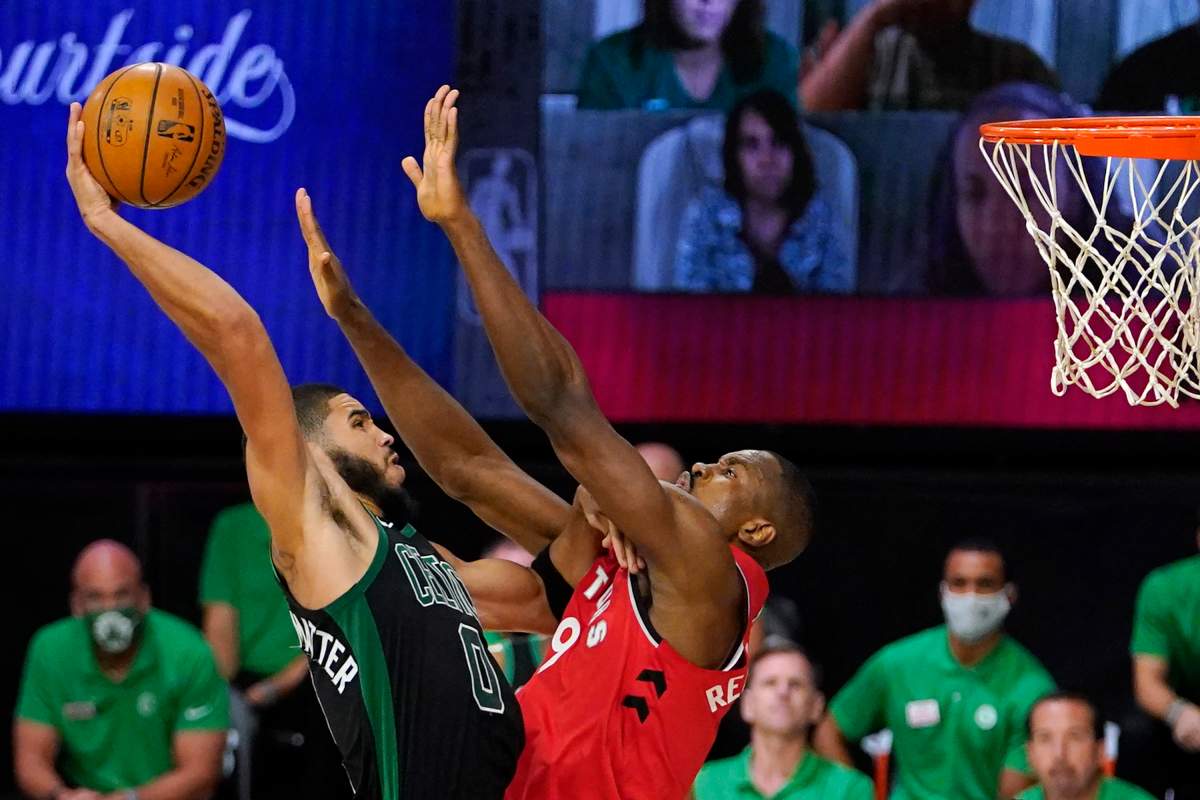 Boston Celtics' Jayson Tatum (0) tries to get a shot over Toronto Raptors' Serge Ibaka (9) during the second half of an NBA conference semifinal playoff basketball game Monday, Sept. 7, 2020, in Lake Buena Vista, Fla. 