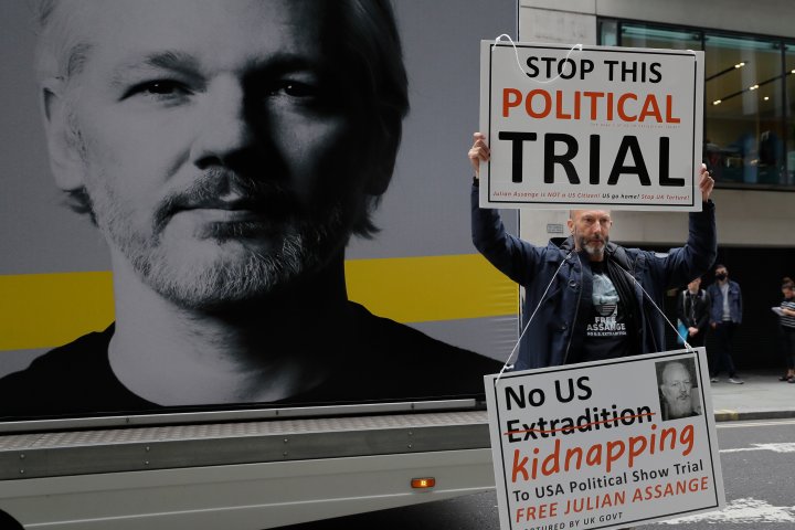 Julian Assange extradition hearing paused over fears lawyer exposed to coronavirus