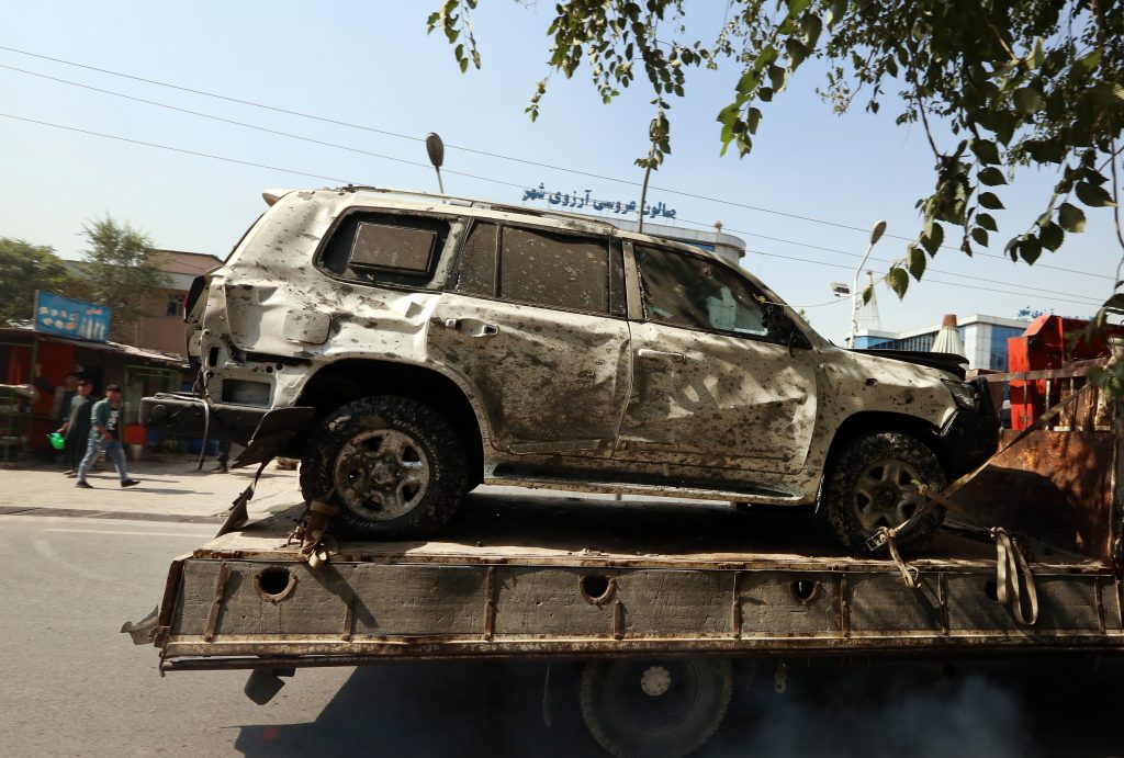 The vehicle that Afghanistan's Vice President Amrullah Saleh was traveling in sits on a truck after an explosion targeted his motorcade in Kabul, Afghanistan.