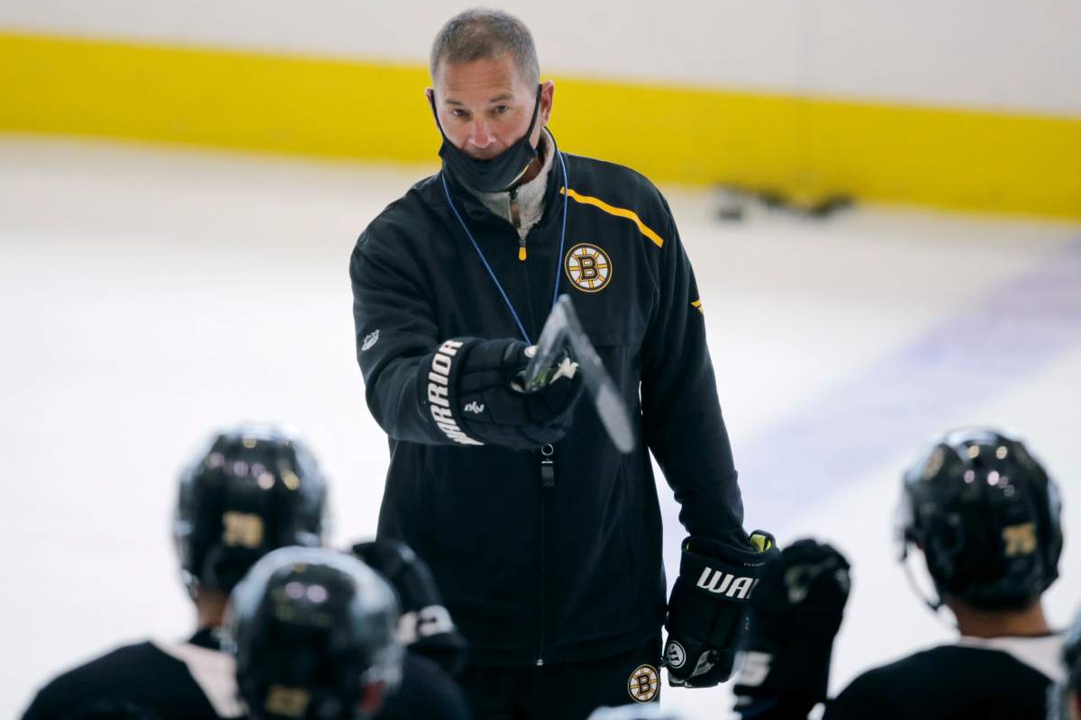 Boston Bruins head coach Bruce Cassidy talks with his players at the NHL hockey team's camp on Tuesday, July 14, 2020, in Boston. Brian Kilrea didn't see a future Jack Adams Award winner when Bruce Cassidy was helping the Ottawa 67's win the franchise's first Memorial Cup. 