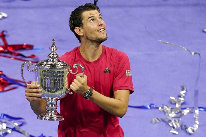 Dominic Thiem, of Austria, holds up the championship trophy after defeating Alexander Zverev, of Germany, in the men's singles final of the US Open tennis championships, Sunday, Sept. 13, 2020, in New York. 