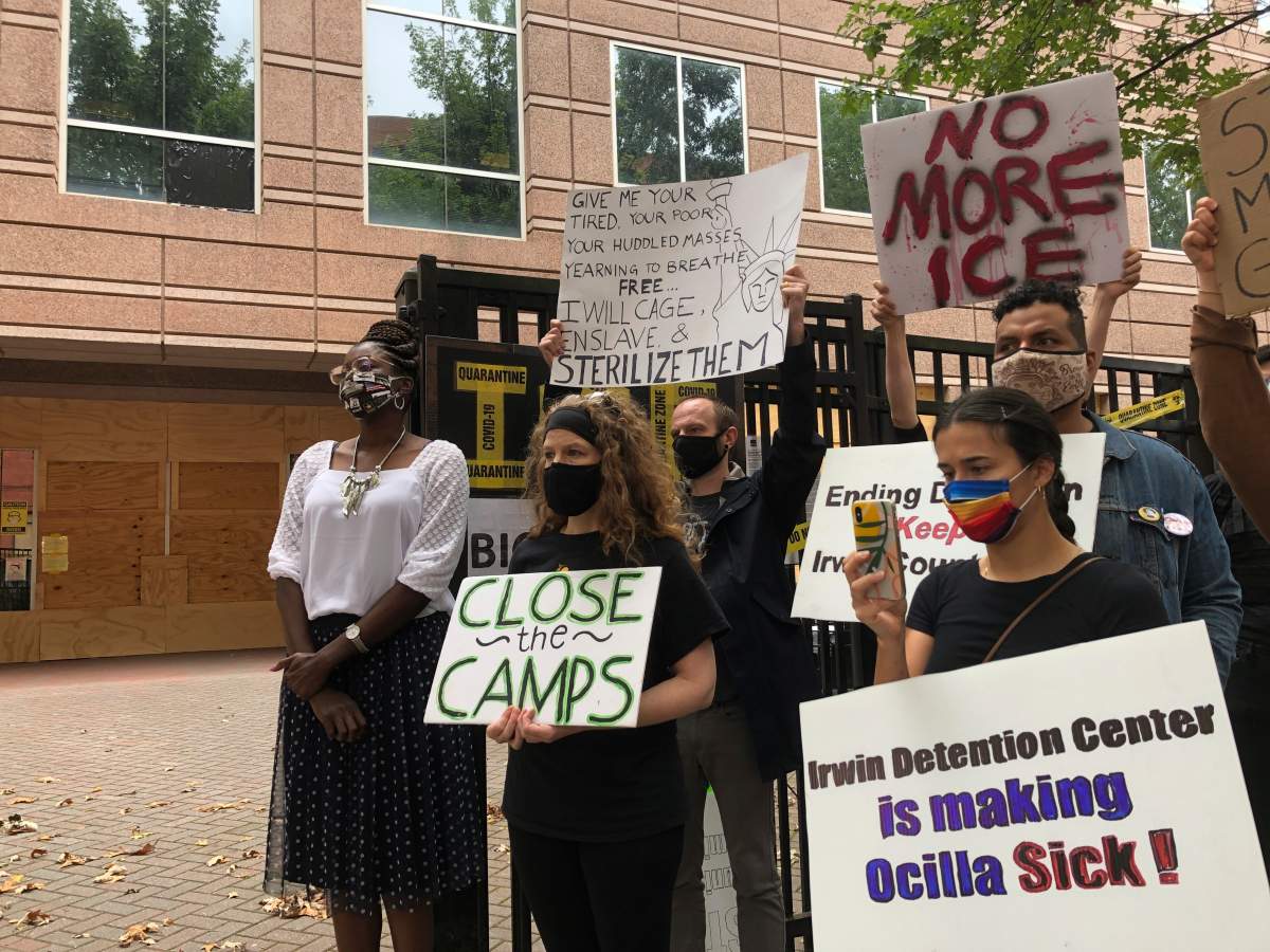 Dawn Wooten, left, a nurse at Irwin County Detention Center in Ocilla, Georgia, speaks at a Tuesday, Sept. 15, 2020 news conference in Atlanta protesting conditions at the immigration jail. Wooten says authorities denied COVID-19 tests to immigrants, performed questionable hysterectomies and shredded records in a complaint filed to the inspector general of the U.S. Department of Homeland Security. (AP Photo/Jeff Amy).