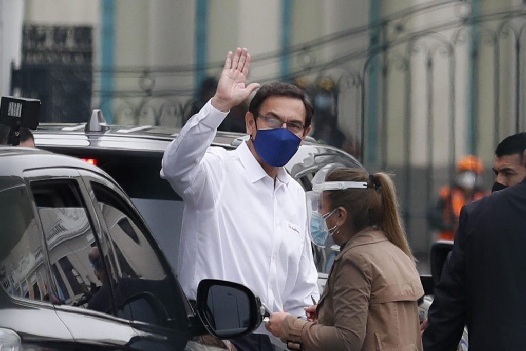 President of Peru, Martin Vizcarra waves after attending a plenary session in the Congress in Lima, Peru, 18 September 2020. Peruvian Congress opened the final debate on 18 September to remove President Martín Vizcarra accused of 'permanent moral incapacity' for his apparent attempts to hide a minor case of corruption, a procedure that in principle does not have the necessary votes to expel the president from power.  