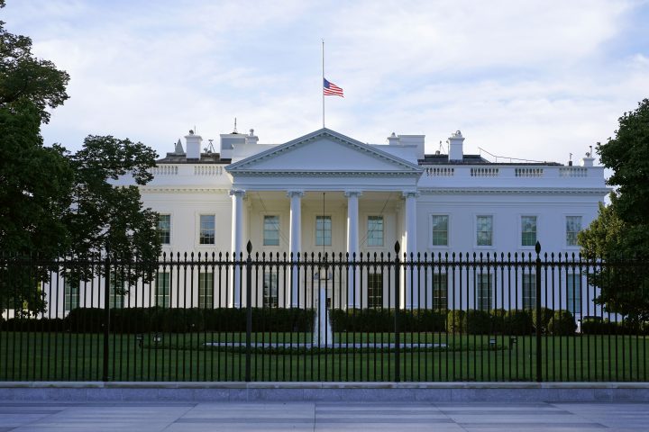 An American flag flies at half-staff over the White House in Washington, Sept. 19, 2020.