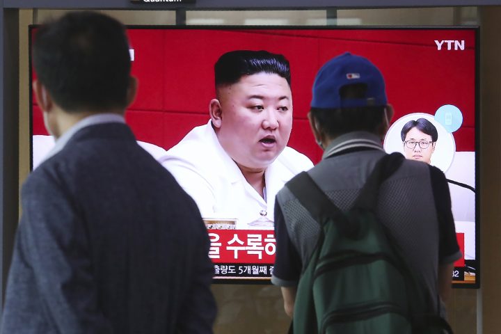 People watch a screen showing a file image of North Korean leader Kim Jong Un during a news program at the Seoul Railway Station in Seoul, South Korea, Friday, Sept. 25, 2020. Kim apologized Friday over the killing of a South Korea official near the rivals' disputed sea boundary, saying he's "very sorry" about the "unexpected" and "unfortunate" incident, South Korean officials said Friday. 