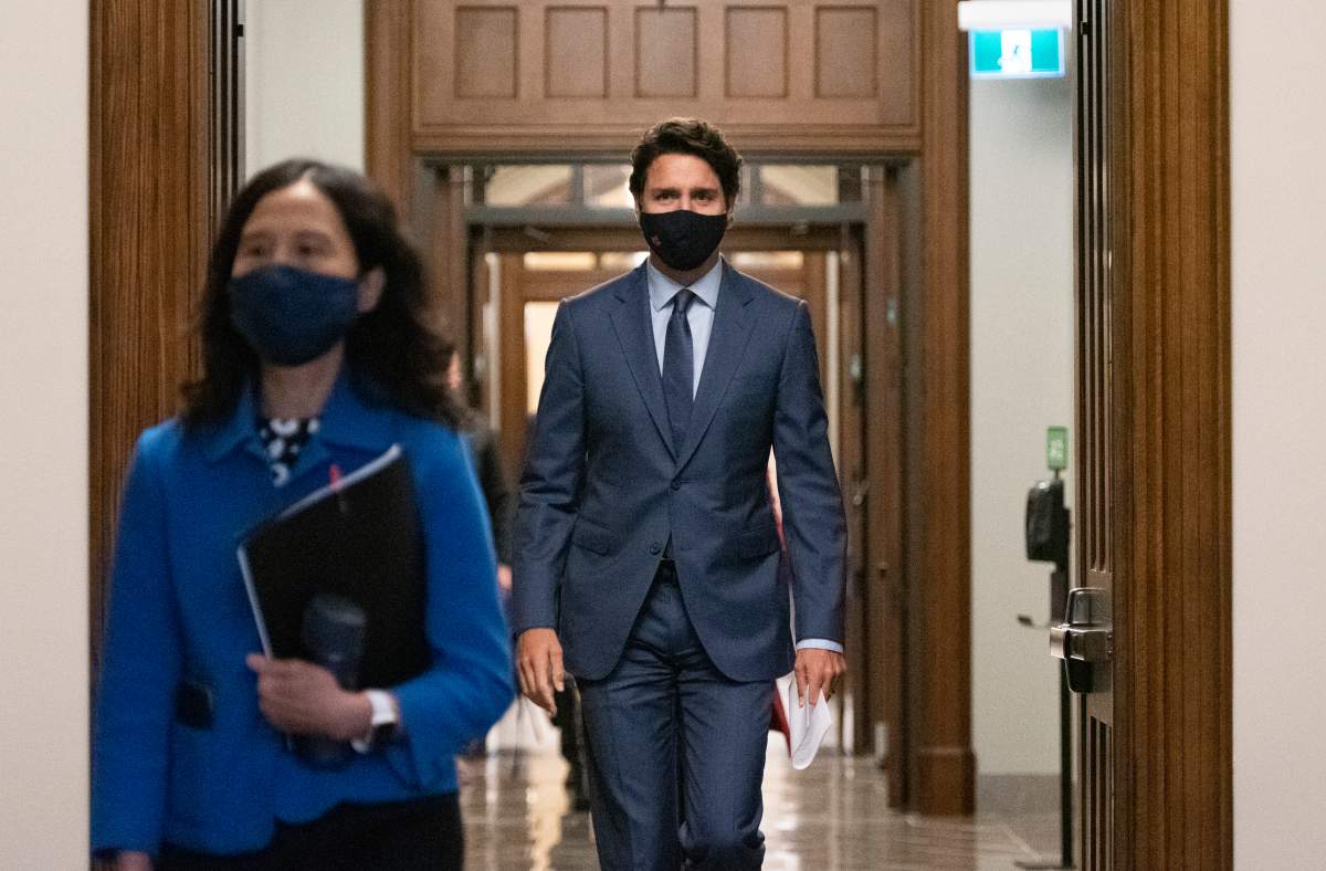 Prime Minister Justin Trudeau arrives with Chief Public Health Officer of Canada Dr. Theresa Tam, left, for a news conference on the COVID-19 pandemic on Parliament Hill in Ottawa, on Friday, Sept. 25, 2020. THE CANADIAN PRESS/Justin Tang.