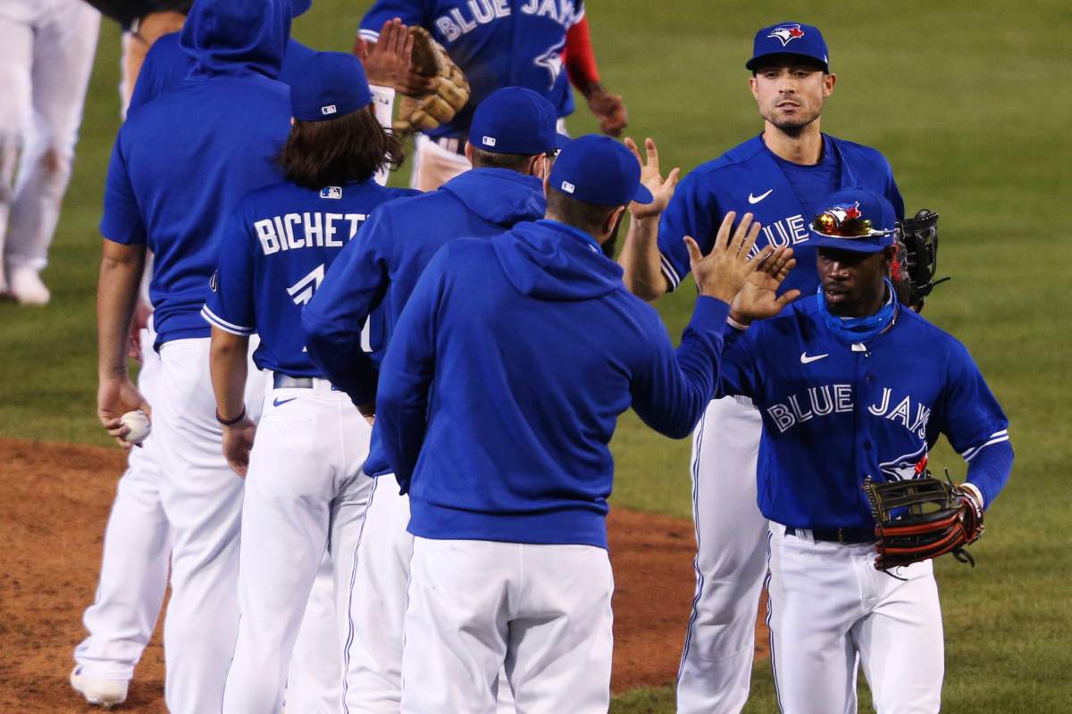 Toronto Blue Jays celebrate a 5-2 win over the Baltimore Orioles in a baseball game Saturday, Sept. 26, 2020, in Buffalo, N.Y. 