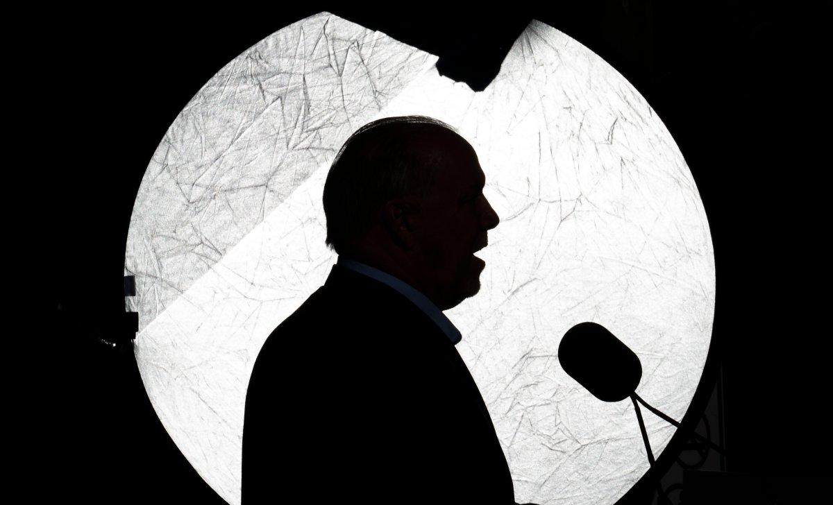 NDP Leader John Horgan is silhouetted against a reflector as he addresses the media during an election campaign stop in Coquitlam, B.C. in this file photo.