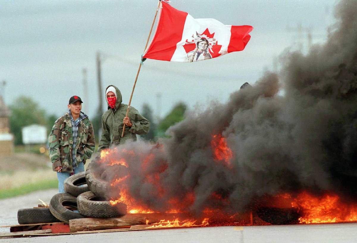 Two protesters man a barricade  near the entrance to Ipperwash Provincial Park, near Ipperwash Beach, Ont., on  Sept. 7, 1995.