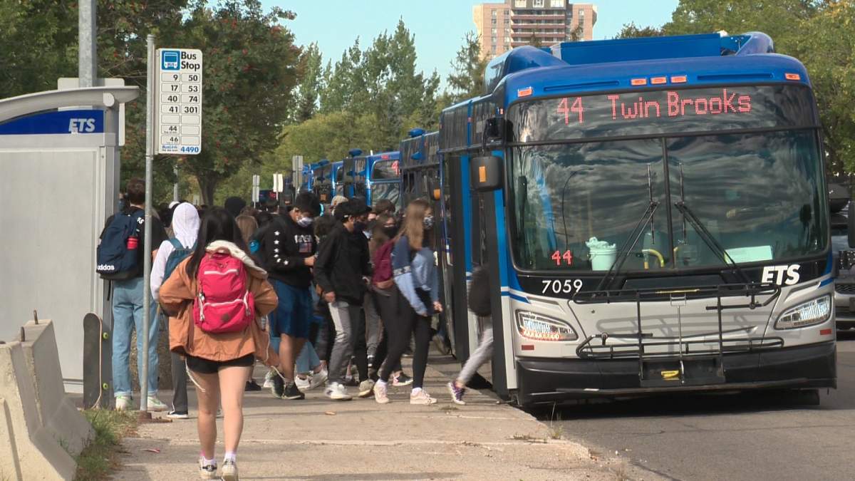 Students board ETS buses at Harry Ainlay School in Edmonton Friday, Sept. 11, 2020.