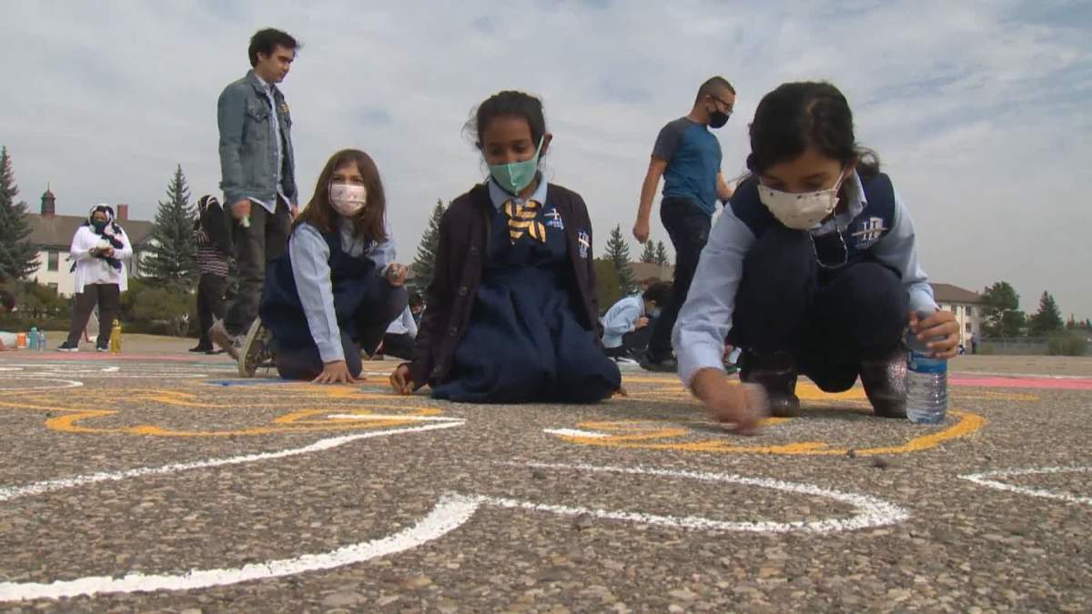 Kids and artists are brightening up the Currie neighbourhood in Calgary with chalk.