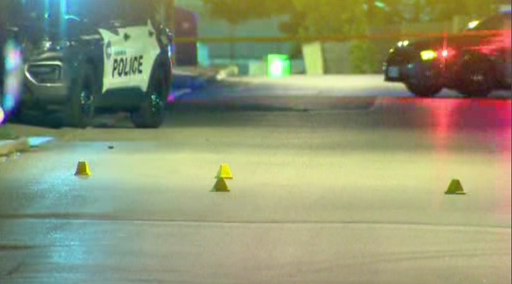 Police lay evidence markers at the scene of a shooting on Bridgeland Avenue Wednesday evening.
