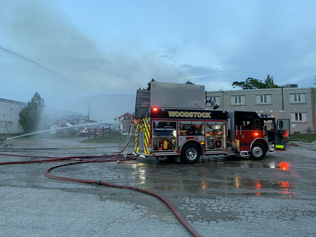 Firefighters work to douse a blaze at the Woodstock Fairgrounds on Sept. 1, 2020.