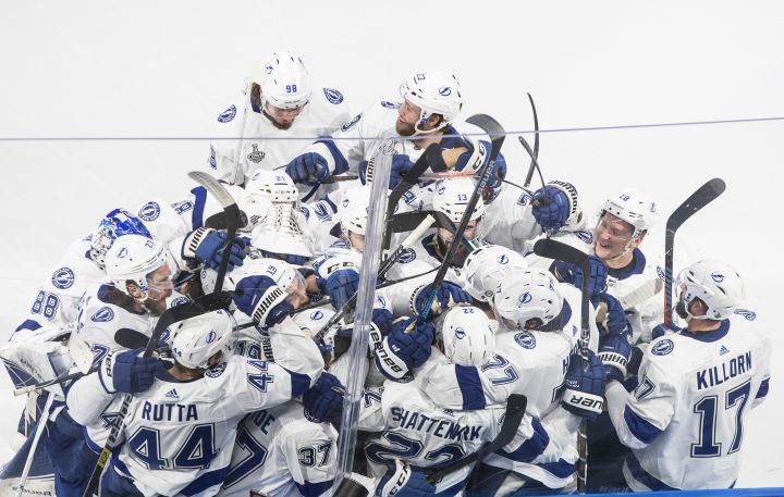 Tampa Bay Lightning celebrate the win over the Dallas Stars on a goal by Lightning defenceman Kevin Shattenkirk (22) during overtime NHL Stanley Cup finals action in Edmonton on Friday, September 25, 2020.