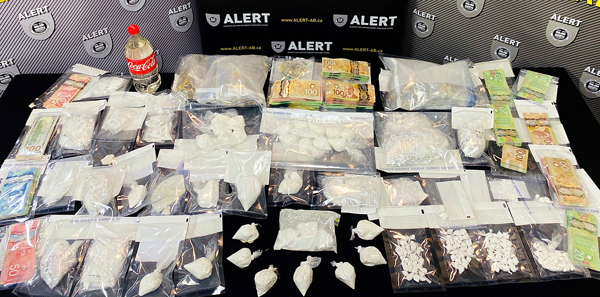 Eight people are facing charges after police in northern Alberta seized more than $260,000 worth of drugs and cash. 