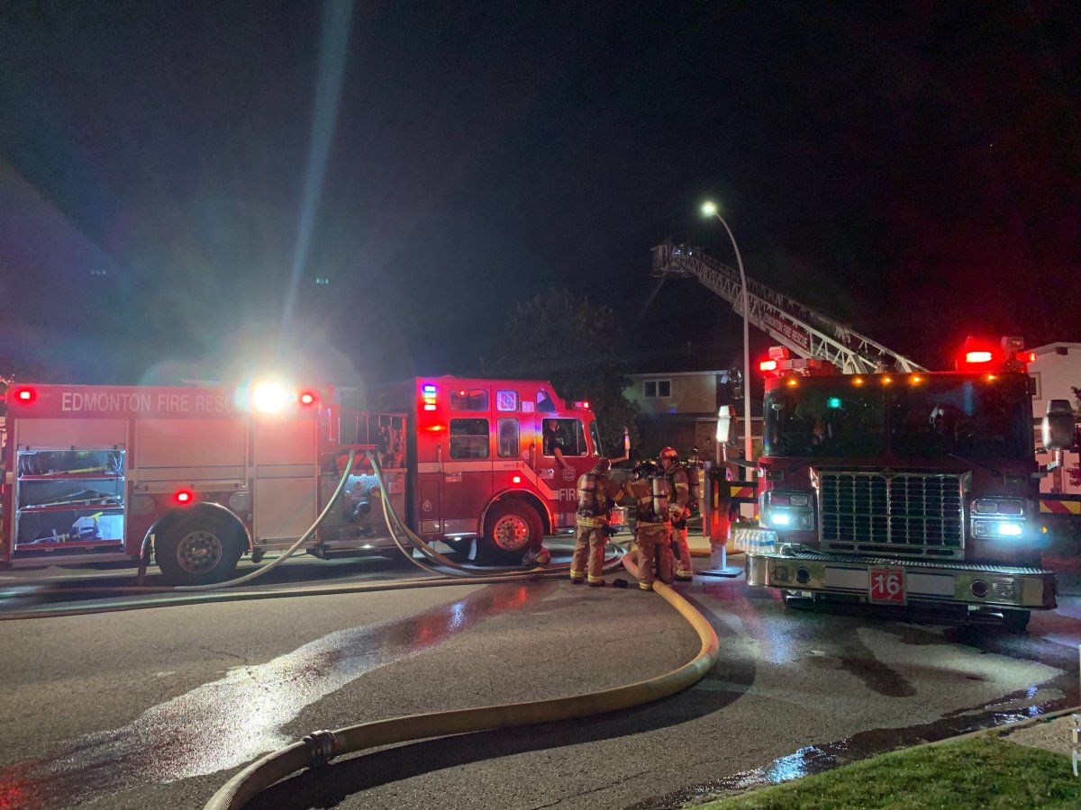 Fire crews battle a blaze at a house at 883 Lee Ridge Rd. in Edmonton Thursday, Sept. 10, 2020.