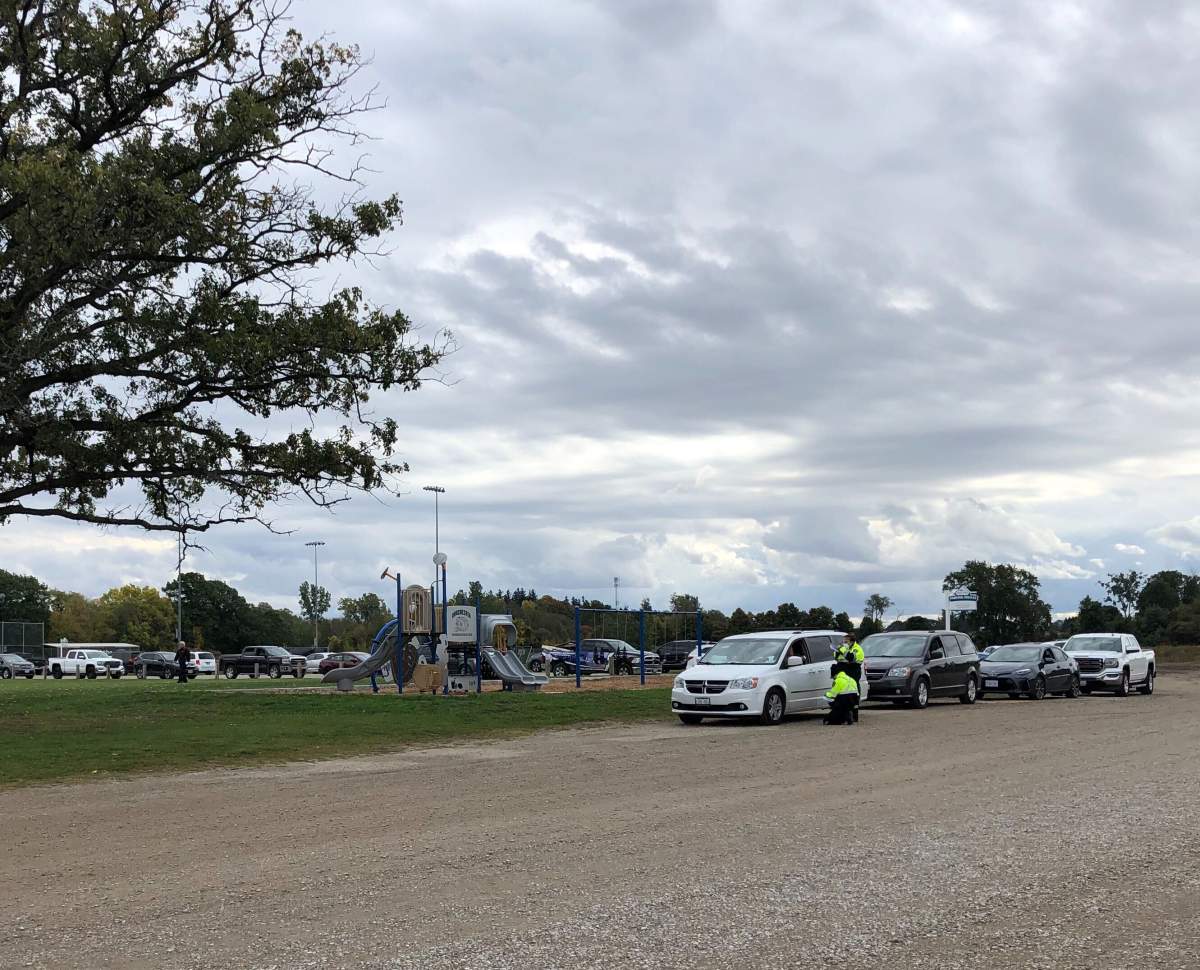 Members of the Middlesex-London Paramedic Service greet patients at a pop-up clinic in Dorchester.