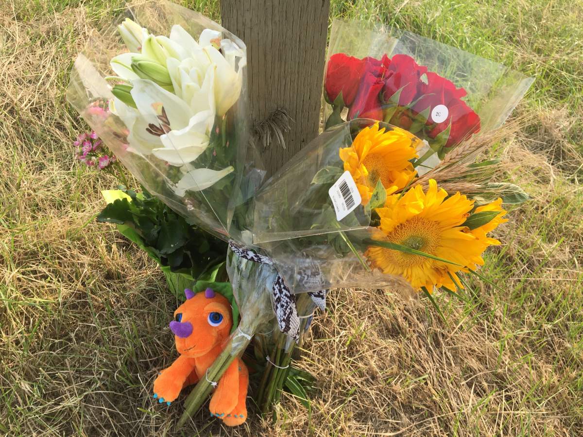A memorial is seen on the side of Highway 21 where two Sherwood Park teenagers lost their lives Thursday night.