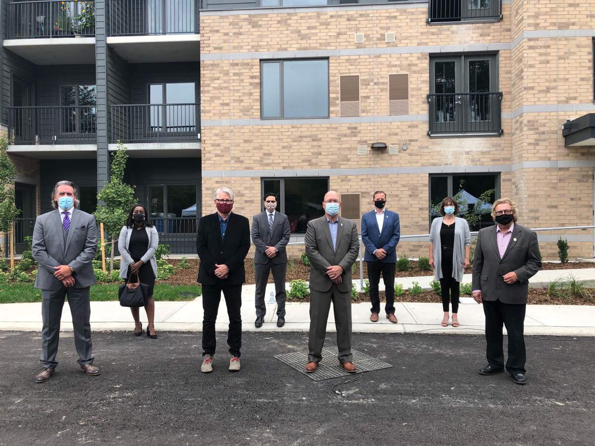 New affordable housing building in London at 1090 Hamilton Rd., from left to right: Roger Caranci, Ward 13 Coun. Arielle Kayabaga, Spadina-Fort York MP Adam Vaughn, London North Centre MP Peter Fragiskatos, Ontario Minister of Municipal Affairs and Housing Steve Clarke, Elgin-Middlesex-London MPP/Ontario Environment Minister Jeff Yurek, London-Fanshawe MPP Teresa Armstrong and London Mayor Ed Holder.