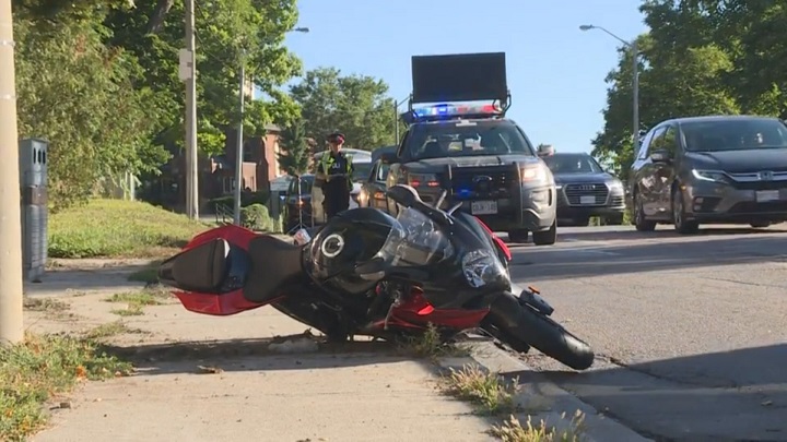 A photo of the motorcycle and police on scene. Dundas Street West and Nottingham Drive.