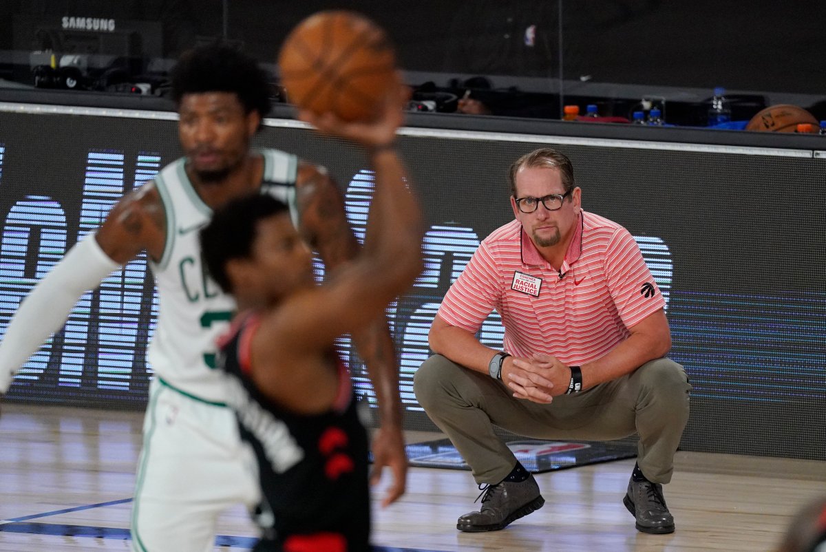 Toronto Raptors' head coach Nick Nurse, right, watches from the bench during the first half of an NBA conference semifinal playoff basketball game against the Boston Celtics Saturday, Sept. 5, 2020, in Lake Buena Vista, Fla.