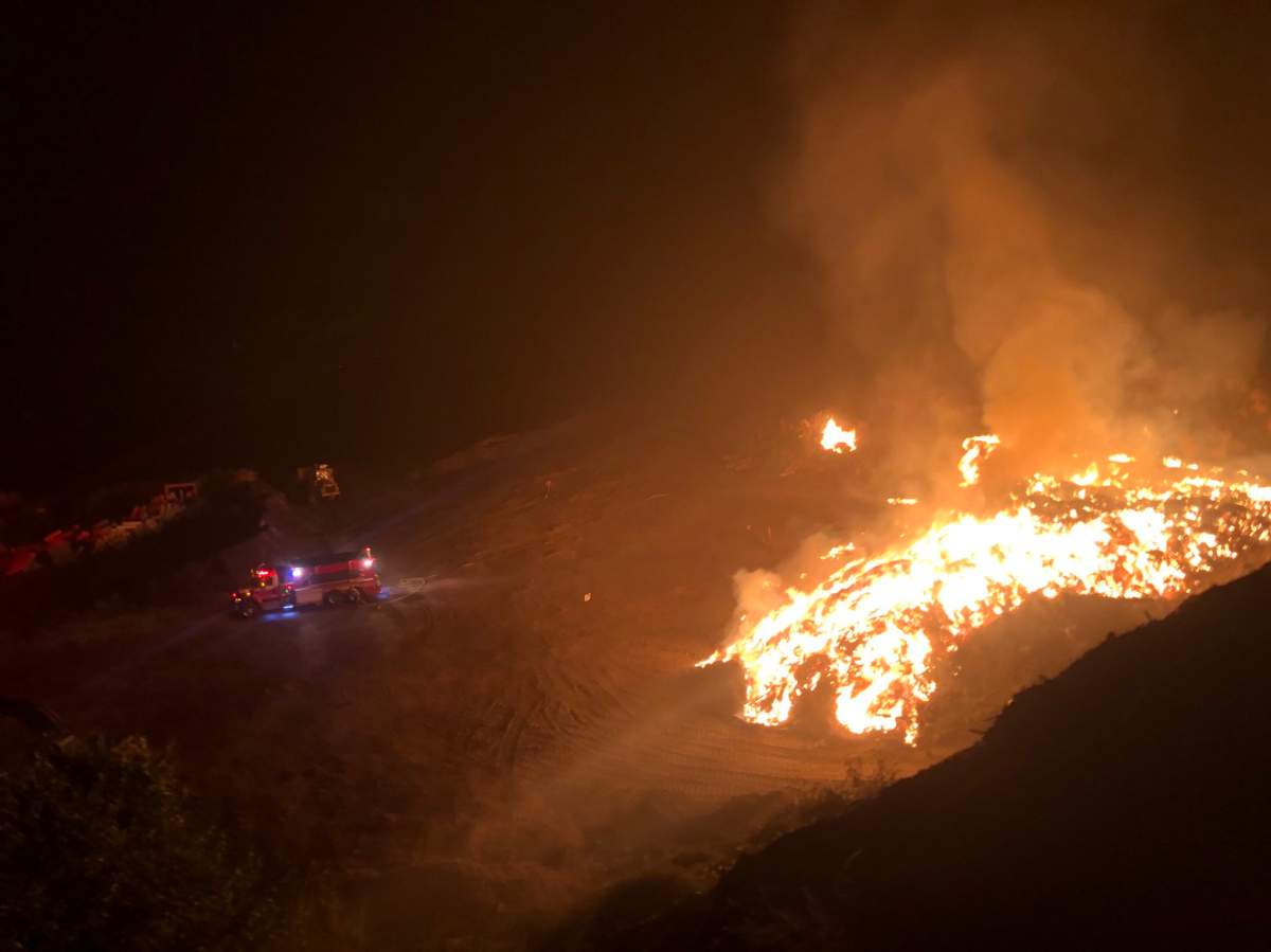 Crews spent several hours extinguishing a wood pile fire at the Campbell Mountain landfill on Sunday night. 