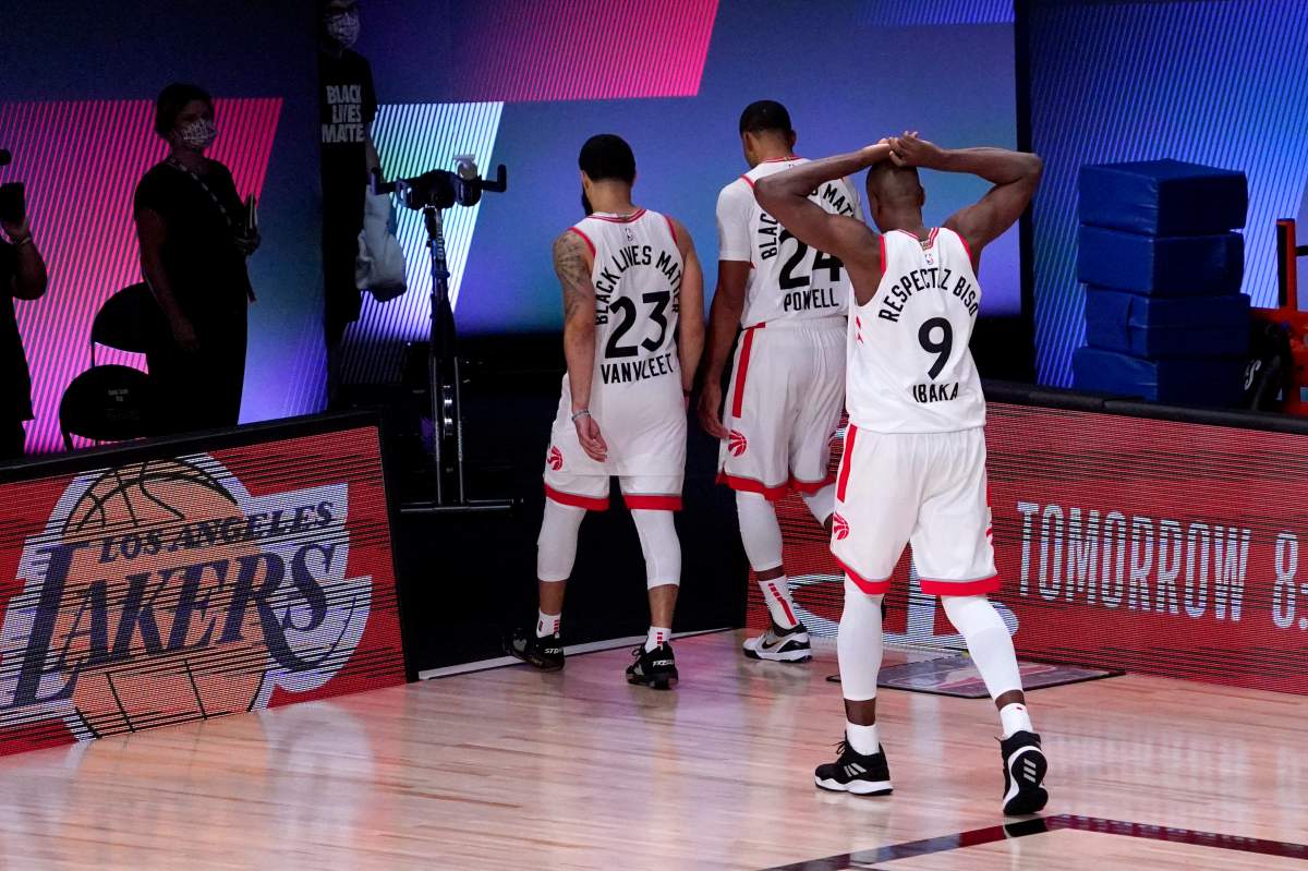 Toronto Raptors' Fred VanVleet (23), Norman Powell (24) and Serge Ibaka (9) head to the locker room after losing to the Boston Celtics in Game 7 of their NBA Eastern Conference semifinal Friday, Sept. 11, 2020, in Lake Buena Vista, Fla.