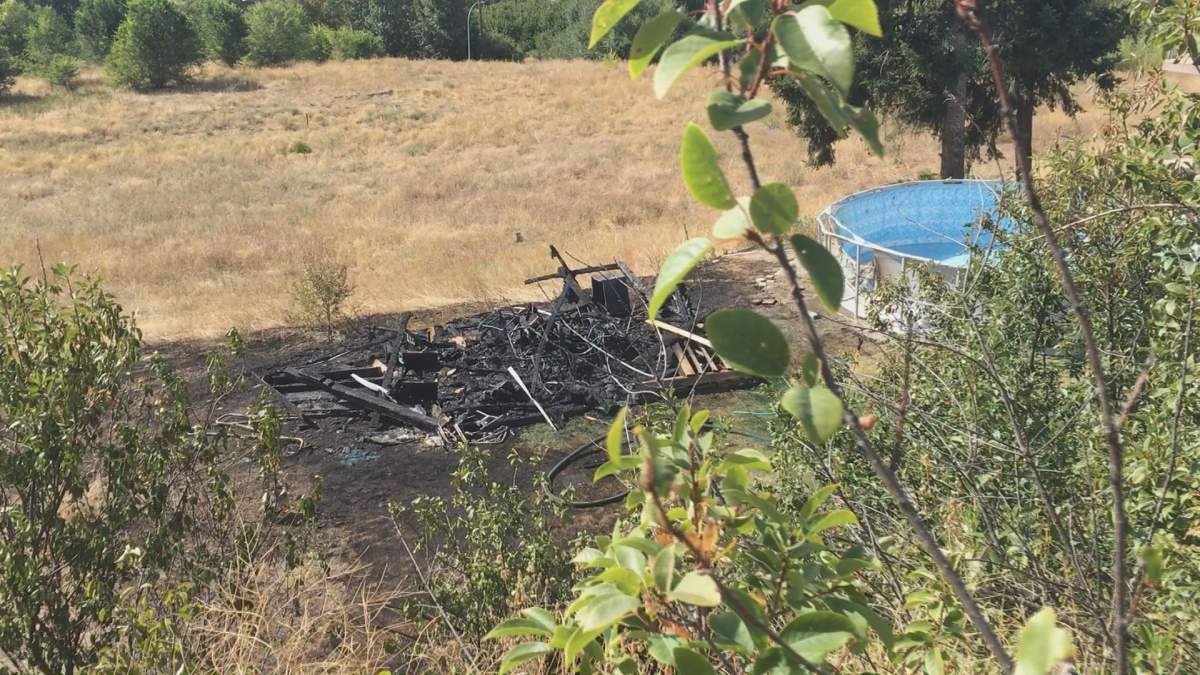 A shed fire in Kelowna spread into nearby grass on Sunday. 