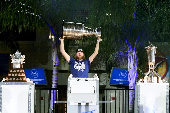 Steven Stamkos of the Tampa Bay Lightning holds the Stanley Cup trophy above his head during the 2020 Stanley Cup Champion rally on September 30, 2020 in Tampa, Florida.