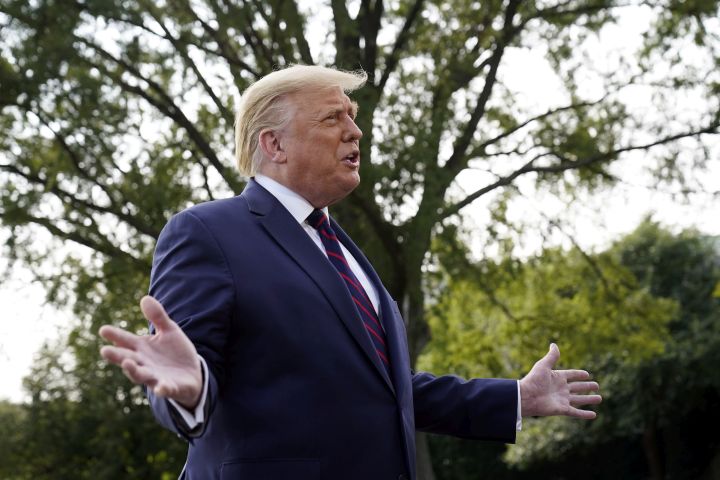 U.S. President Donald Trump speaks with reporters as he walks to Marine One on the South Lawn of the White House, Tuesday, Sept. 15, 2020.