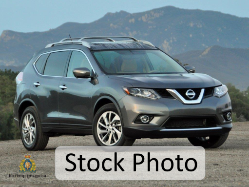 A generic, stock photo of a grey 2014 Nissan Rogue.